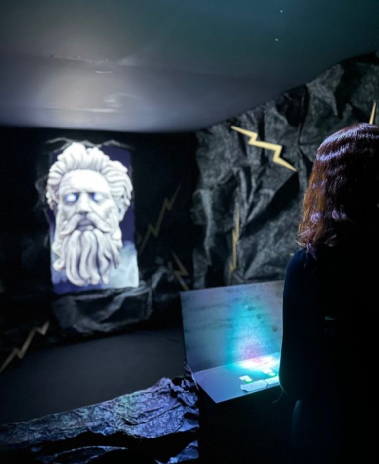 Shots from event where people interact with Zeus AI persona