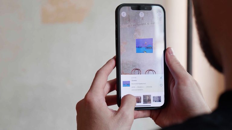 screens from AR mobile app trying image on actual wall