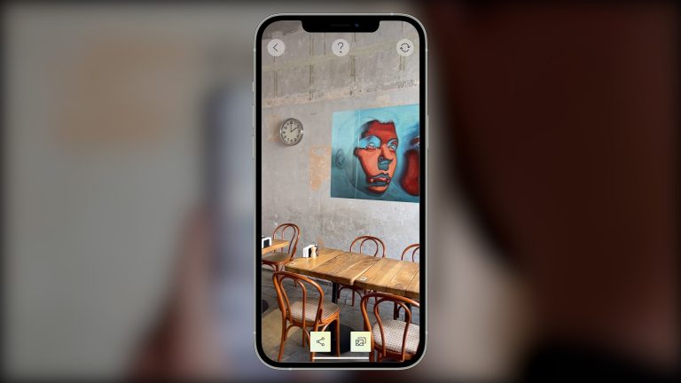 screens from AR mobile app on wall